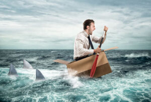 Fearful Businessman escapes screaming from sharks on a cardboard