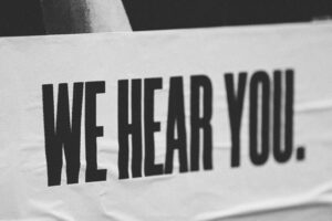 A poster for validation reads, "We hear you."